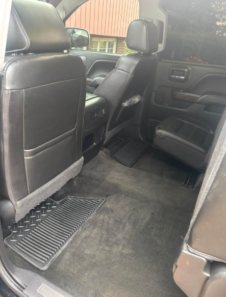 Clean rear passenger area and carpets inside a GMC Denali truck